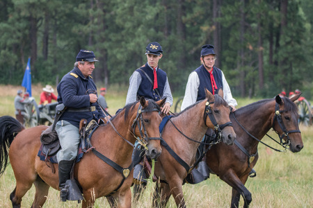 Red Bluff, California, United States-April 25, 2015: Union cavalry scouts ride up to the enemy lines and discover rebel positions during a Civil War reenactment.のeditorial素材