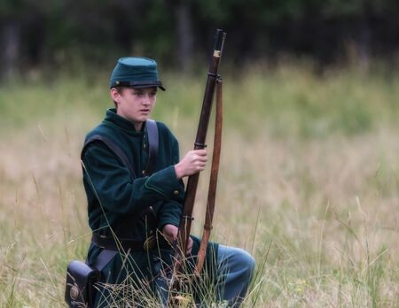 Confederate Civil War Reenactor during a battle in Graeagle, California.のeditorial素材