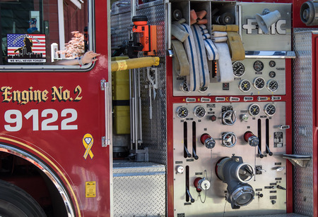 Graeagle, California, USA- July 5, 2015: Detail of a fire engine's hoses and water pumping controls...