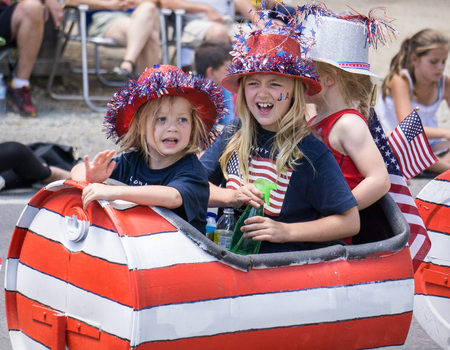 Graeagle, California, USA- July 5, 2015: Three girls in a modified barrel ride in the Mohawk Valley...