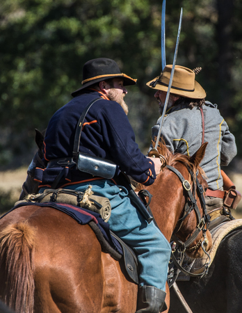 Union and Confederates engage in combat, Civil War reenactment, Anderson, California.のeditorial素材