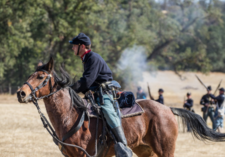 Union cavalry Scout advances towards the  enemy at a Civil War reenactment, Anderson, California.のeditorial素材