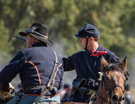 Two Union cavalry Scouts observe the enemy at a Civil War reenactment, Anderson, California.のeditorial素材