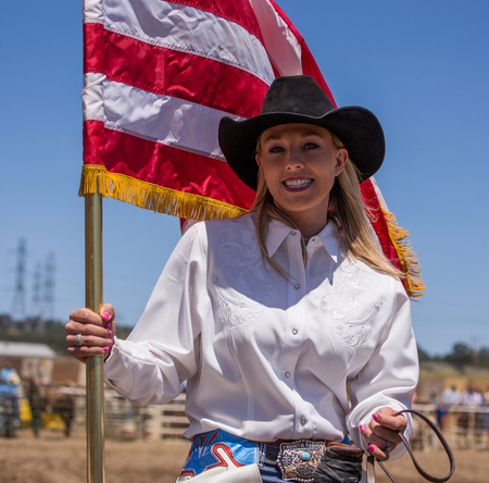 Cowgirl with American Flag, Cottonwood Rodeo, Cottonwood, California.のeditorial素材