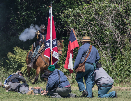 Confederates defend against a cavalry scout   at Dog Island  Civil War Reenactment, Red Bluff, Californiaのeditorial素材