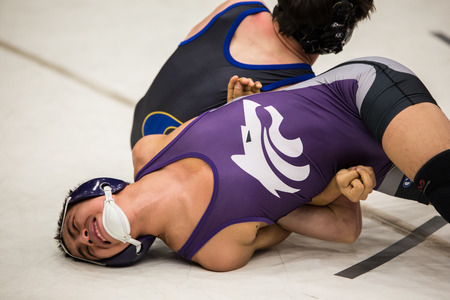 Photo taken  03/06/2016 :  wrestlers on the mat against each other in the NCSIF Wrestling Championships in northern California.のeditorial素材