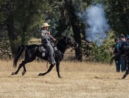 Cavalry scouts at war in a Civil War reenactment at Hawes Farm in Anderson, California.のeditorial素材