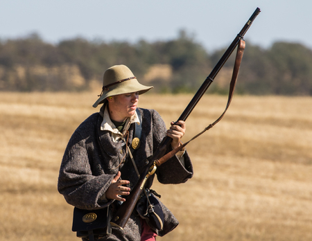 Confederate in combat at the Hawes Farm Reenactment in Anderson, California.のeditorial素材