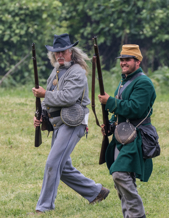 Civil War reenactors in battle  at the Dog Island Reenactment in Red Bluff, California.のeditorial素材