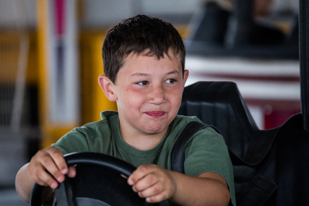 Kids enjoying the bumper cars  ride at the Shasta County Fair in Anderson, California.のeditorial素材