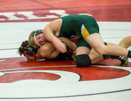 Redding, California: Two wrestlers on the mat against each other in the NCSIF Wrestling Championships in northern California.のeditorial素材