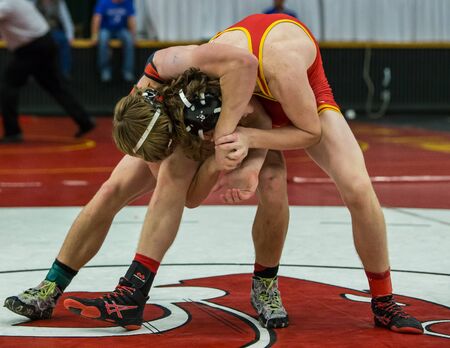 Redding, California: Two wrestlers on the mat against each other in the NCSIF Wrestling Championships in northern California.のeditorial素材