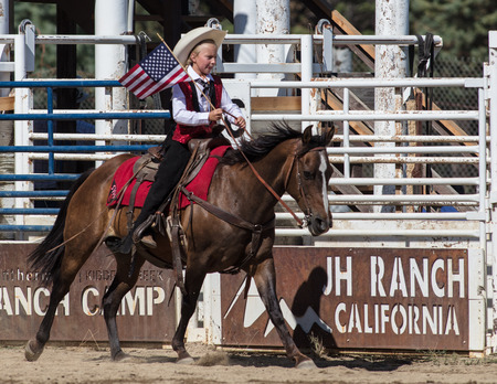 Junior rodeo action at the Scott Valley Rodeo in Etna, California.のeditorial素材