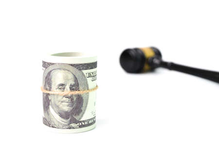 Money banknotes and judge gavel over white background. Selective focusの写真素材