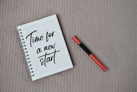 Notebook written with text TIME FOR A NEW STARTの写真素材