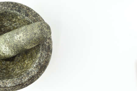 Granite pestle and mortar isolated on a white background.の写真素材