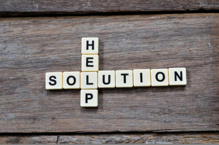 Top view of square letters with text HELP and SOLUTION.の写真素材
