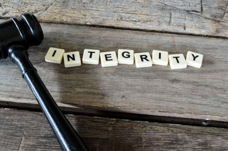 Judge gavel and square letters with text INTEGRITY.の写真素材