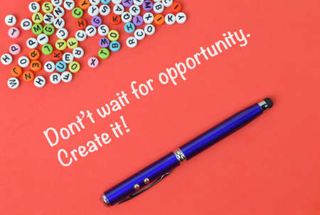 Red background written with DON'T WAIT FOR OPPORTUNITY. CREATE IT!の写真素材