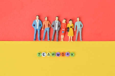 People miniatures and alphabet beads with text TEAMWORK.の写真素材
