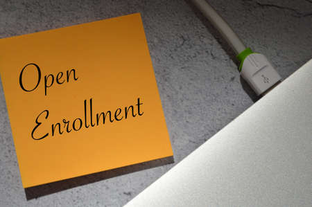 Memo note written with text OPEN ENROLLMENT.
