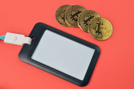 Golden bitcoins and name tag with copy space.