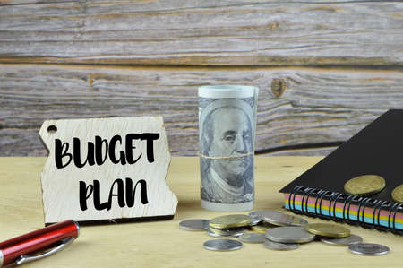 Wooden tag written with text BUDGET PLAN.