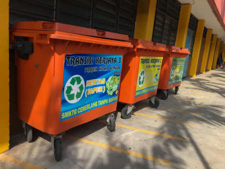 Klang,Malaysia: March 10, 2021- Different colored bins for collection of recycle materialsのeditorial素材