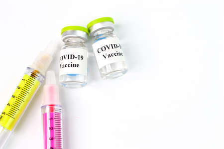 Covid-19 bottle vaccination and syringe isolated on a white background