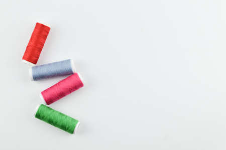 Bunch of colorful threads over white background with copy space.の写真素材