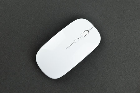 Top view of computer mouse over black background.