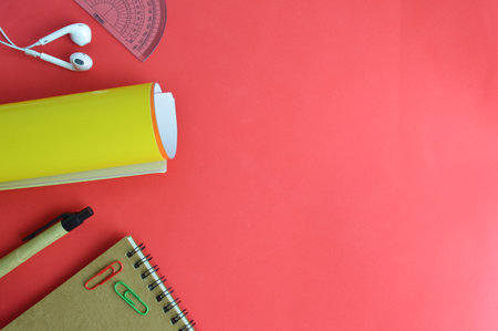 Stationery tools over red background with copy spaceの写真素材