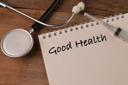 Stethoscope and notebook written with GOOD HEALTHの写真素材