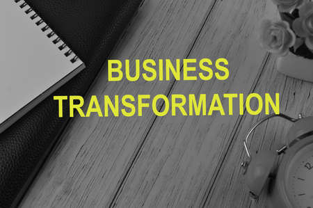 Wooden background written with text BUSINESS TRANSFORMATIONの写真素材