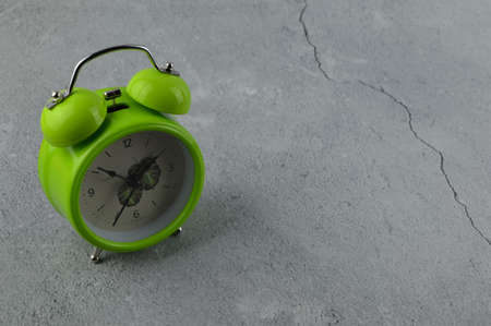 Top angle view of alarm clock over grey backgroundの写真素材