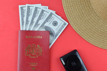 Passport, camera, hat and money banknotes. Travel concept.の写真素材
