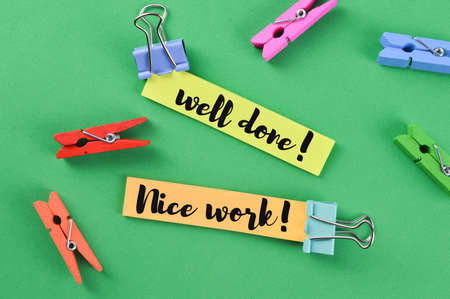 Memo note written with WELL DONE! and NICE WORK!
