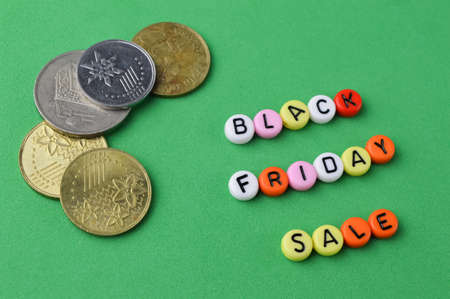 Coins and alphabet beads with text BLACK FRIDAY SALEの写真素材