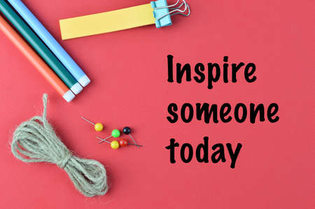 Red background written with INSPIRE SOMEONE TODAYの写真素材