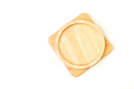 Top view of round wooden plate isolated on a white backgroundの写真素材