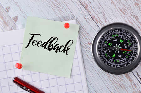 Top view of memo note written with text FEEDBACK. Business concept.の写真素材