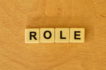Top view of square letters with text ROLE.の写真素材