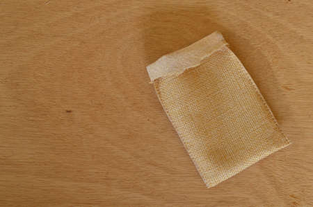Top view of gunny bag isolated on a wooden backgroundの写真素材