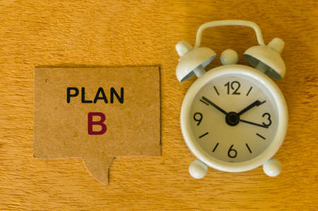 Speech bubble note written with PLAN B with clock. Business and education concept.の写真素材