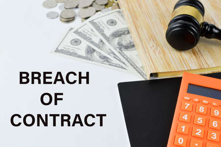Phrase BREACH OF CONTRACT written over white background with coin, money banknote, judge gavel and...