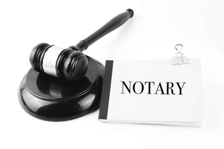Judge gavel and notebook written with NOTARY.の写真素材