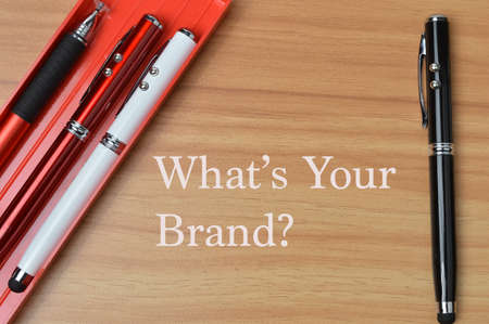 Wooden table written with WHAT'S YOUR BRAND?の写真素材
