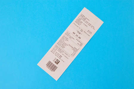 Klang,Malaysia : May 6, 2021- paper sales receipt isolated on a blue background.のeditorial素材