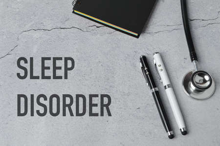Phrase SLEEP DISORDER written on grey background. Conceptual imageの写真素材