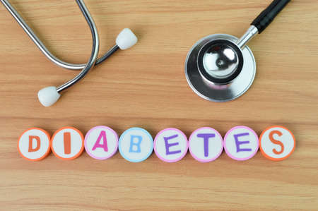 Top view of stethoscope and alphabet letters with text DIABETESの写真素材